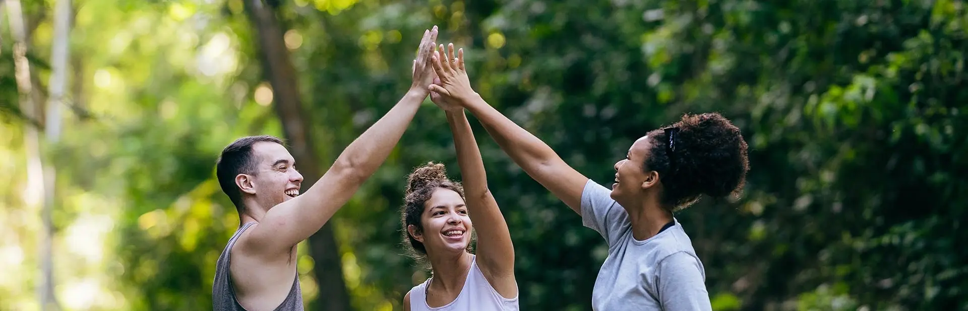 three-people-high-five